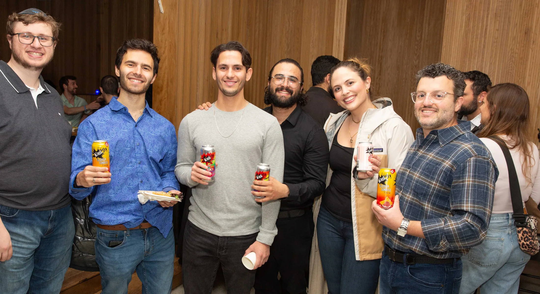 A group of young adults together at a Kollel community gathering
